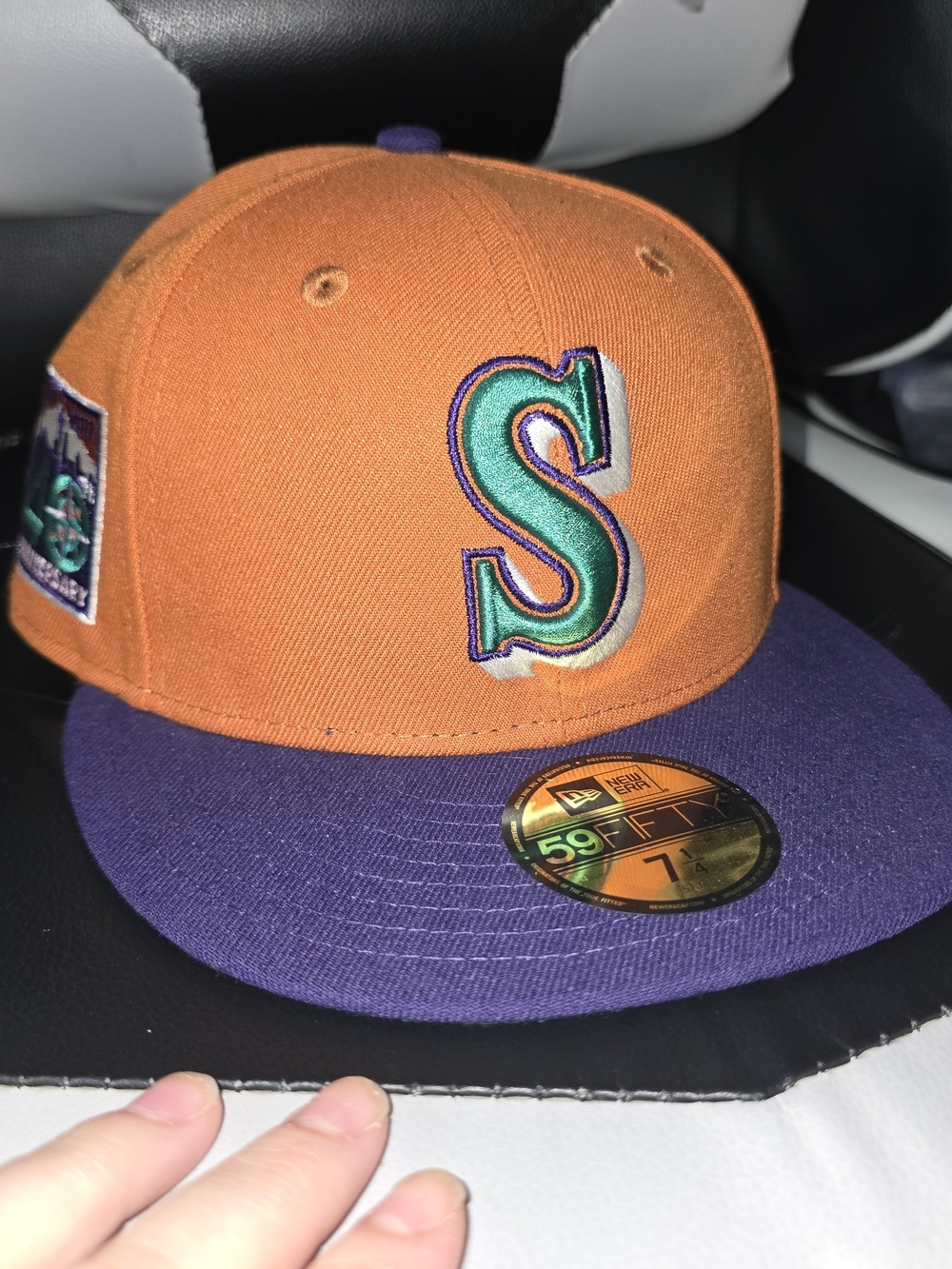 Seattle Mariners. Orange and Purple Baseball Cap with Green 'S' Embroidery